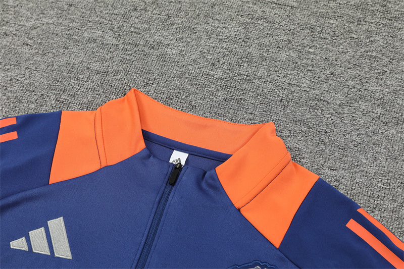 Manchester United 2024/25 Training Tracksuit (Navy and Orange)